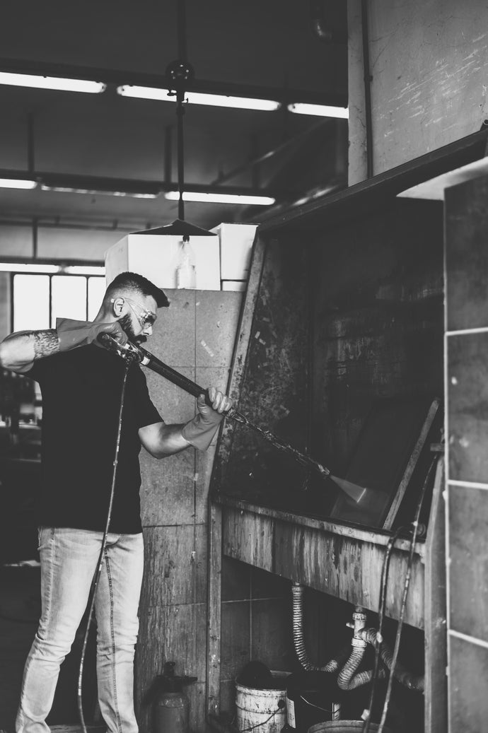 man cleaning a screen